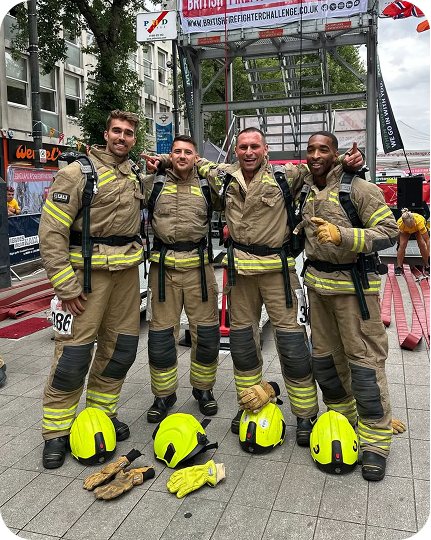 Firefighters posing together after tower challenge competition event.